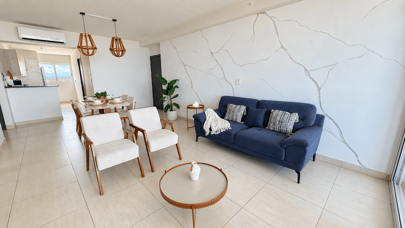 Distribución integrada de sala, comedor y cocina abierta